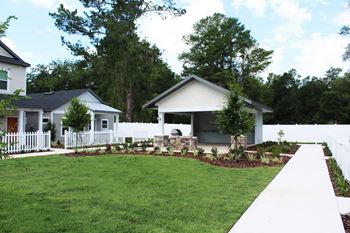 Covered community pavilion with fire pit and seating area